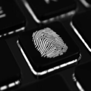 Fingerprint on keyboard key symbolizing digital investigation - Private Investigator Training Bundle