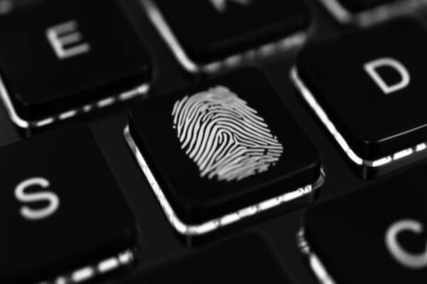 Fingerprint on keyboard key symbolizing digital investigation - Private Investigator Training Bundle